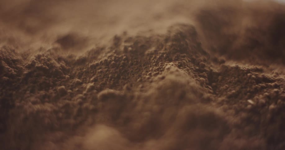 Textured dirt covers a surface
