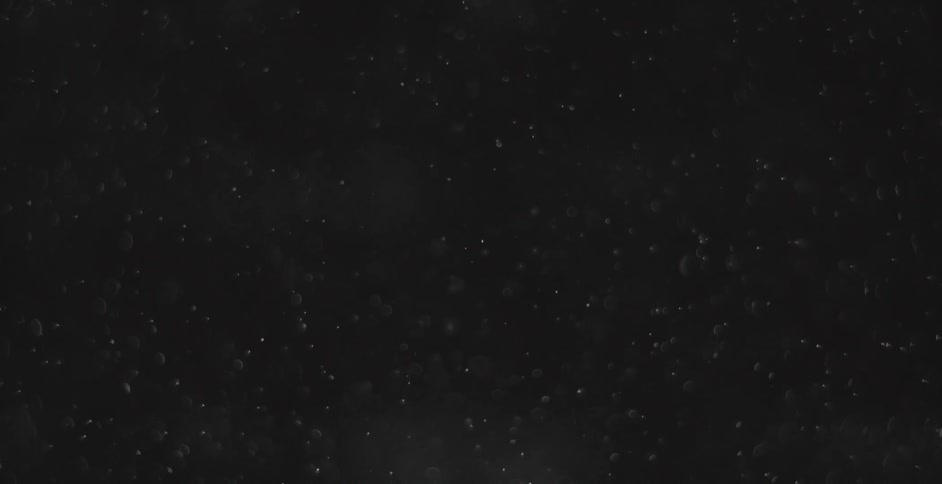 Dust floats around a black area
