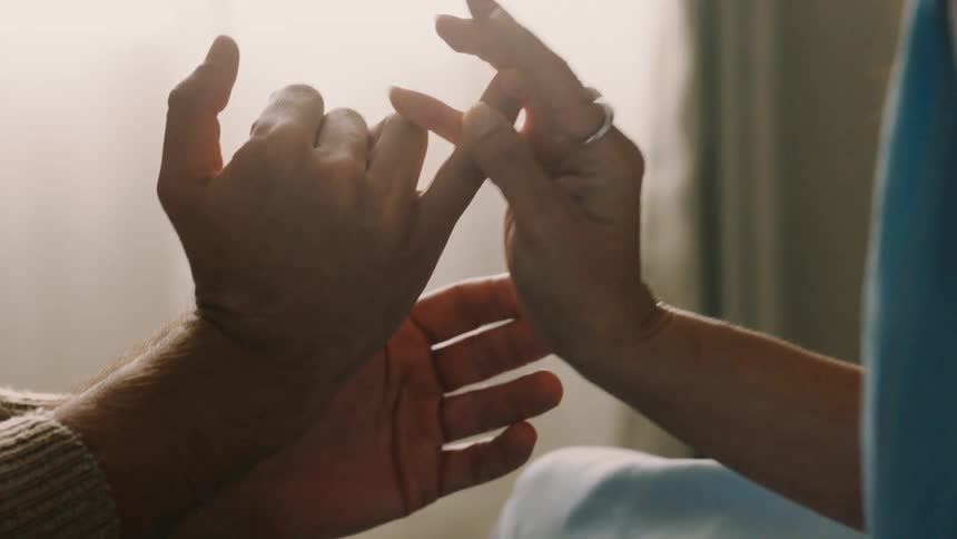 The hands of two people who are using their fingers to start playing finger wars
