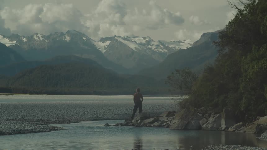 A person looks out to the mountains
