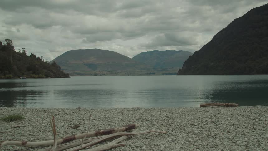 A lake is in the middle of the mountains