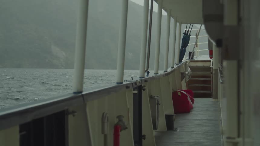 Deck of a moving ship on the sea at dawn