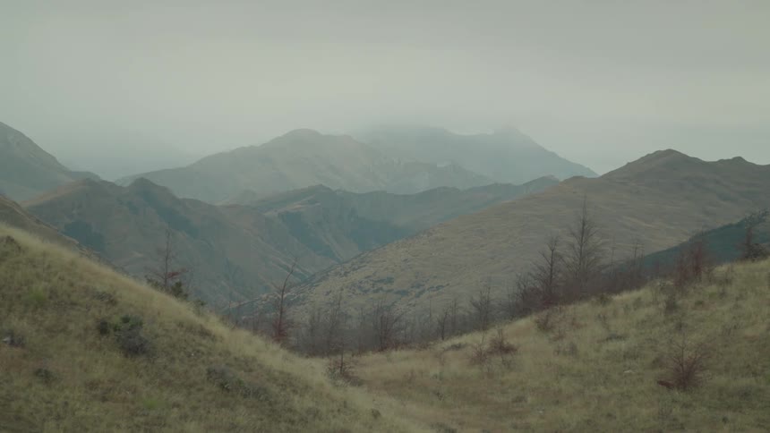 A scenic mountain range with natural outdoor beauty under a clear sky