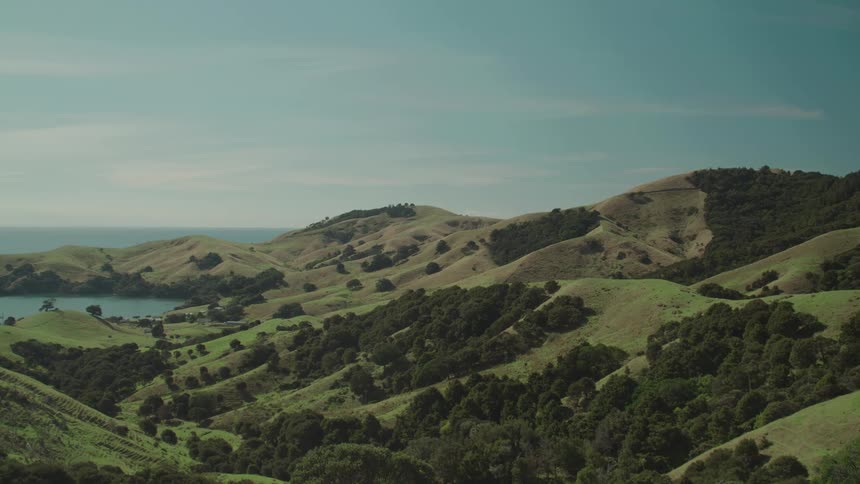Landscape of a mountain valley and a lake on the horizon