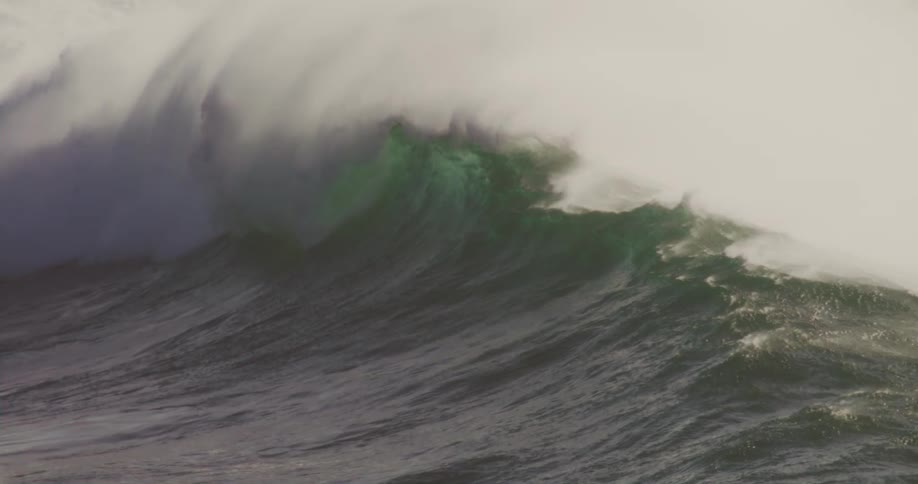 A large wave rolls in and collapses before forming a good roll