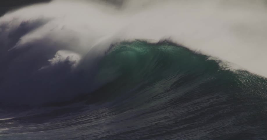 The huge waves slowly falls by the shore