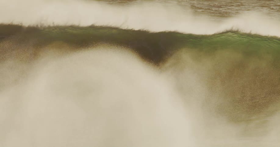 Many large waves repeatedly crash in the ocean