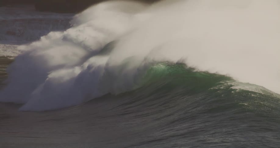 The large wave moves towards the shore slowly