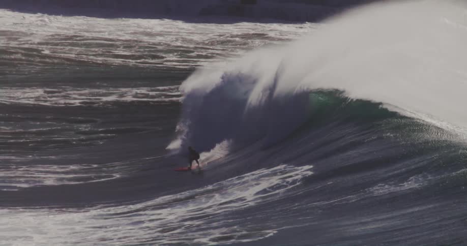 The wave is following the surfer