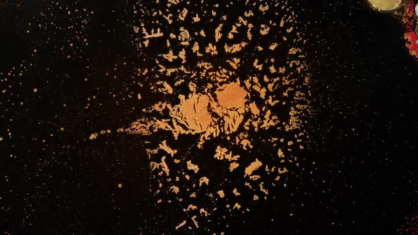 A space galaxy with a yellow space rock shattered into small pieces
