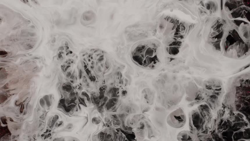 Abstract moving organic liquid against a black background