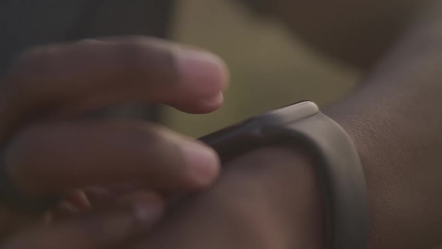 A person scrolling through an apple watch on their wrist