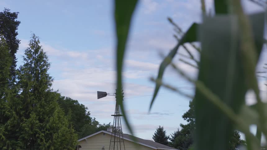 A windmill turns in the wind
