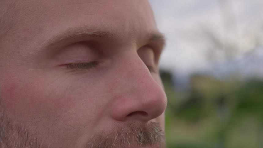A close up of a mans face