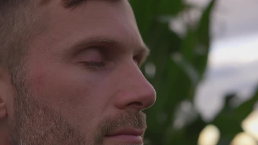 A man closes his eyes in slow motion