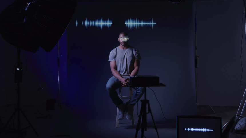 Electronic waves gloss over a mans eyes