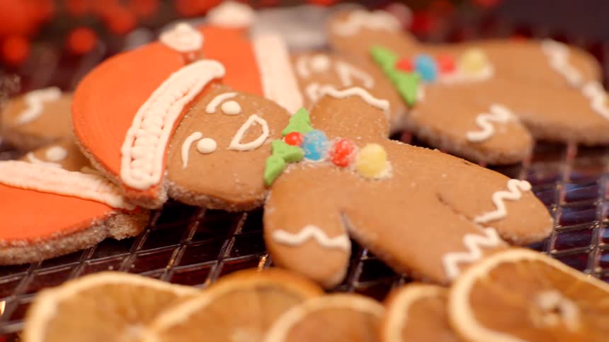 Christmas gingerbread cookies lie on a tiled surface