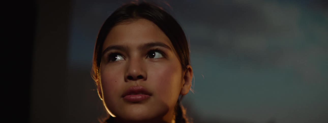 A girl looks around the room