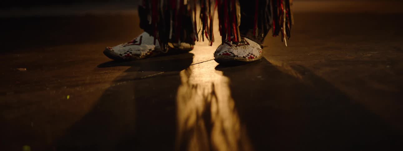 A person in a costume is standing on the stage