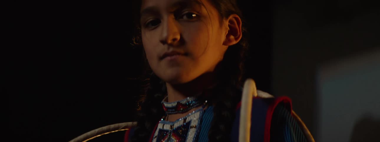 A girl is holding hoops