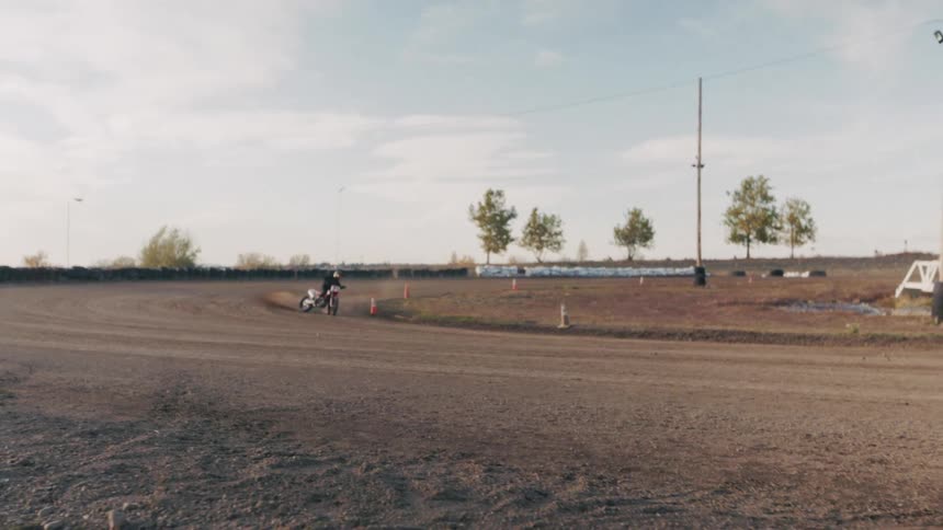 Motocross person on a dirt track at high speed