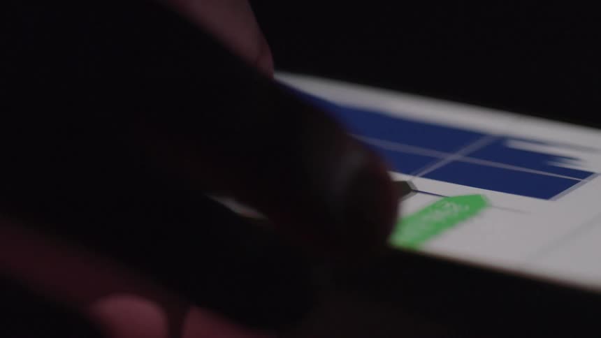A person scrolls on an app on their cell phone