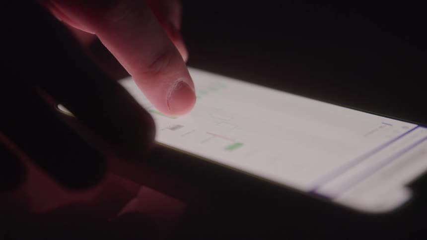 A person is touching the bar graph on their phone