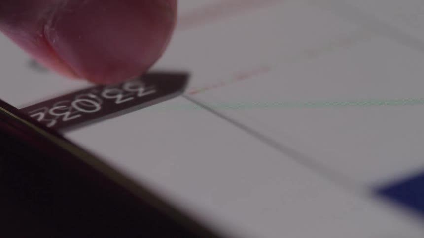 A person is scrolling through information on their cell phone