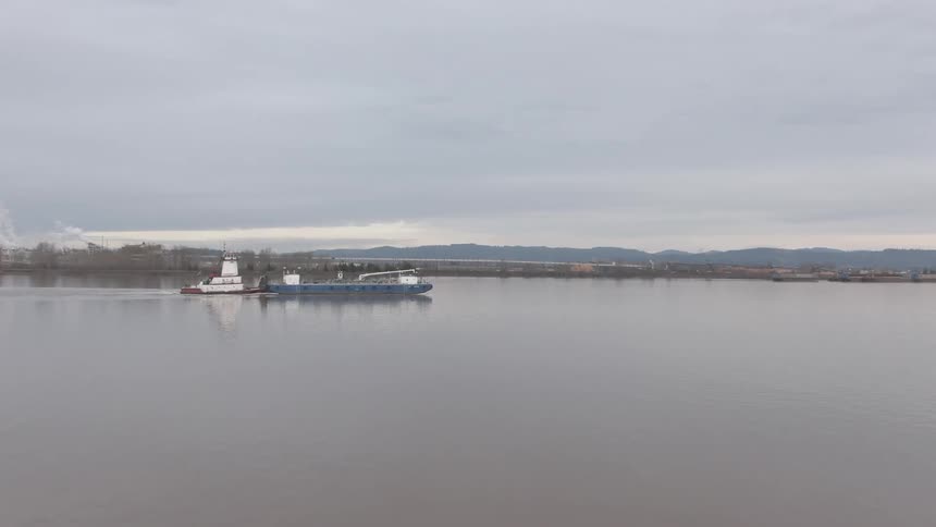 Logistics ship in a sea on a cloudy day