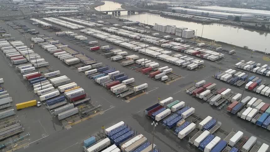 Aerial of a container terminal in a city during daytime
