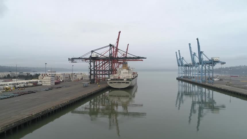 Aerial view of vessels in a sea channel of a port