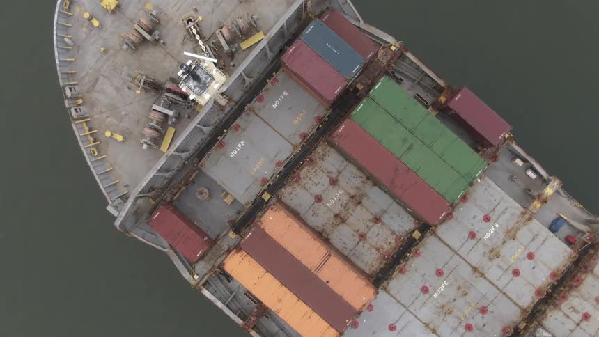 A cargo ship with many containers on it