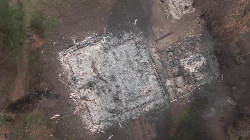 Looking down at the ruins of a house