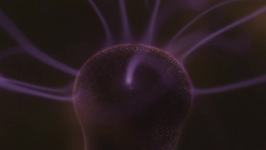 Purplehued electrical discharges emanate from a central sphere in a dark field