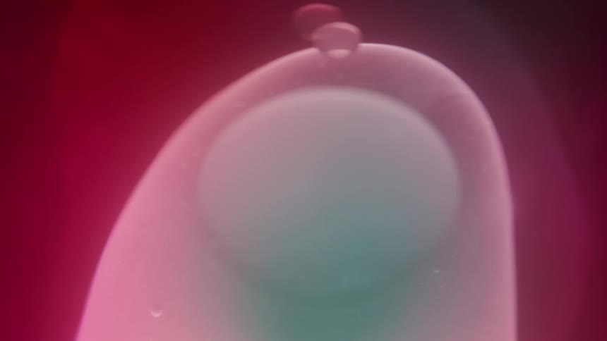 Purple lava lamp fluid moving slowly forming spears