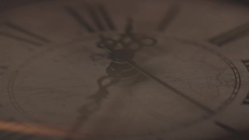 Closeup of an antique clock in motion