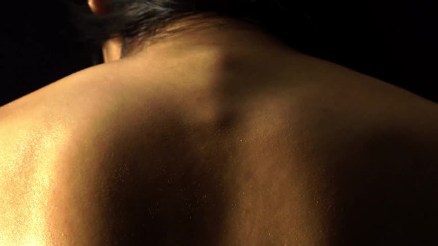Closeup of a womans shirtless back