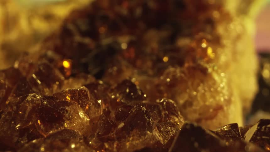 Light reflects on the gold and crystals