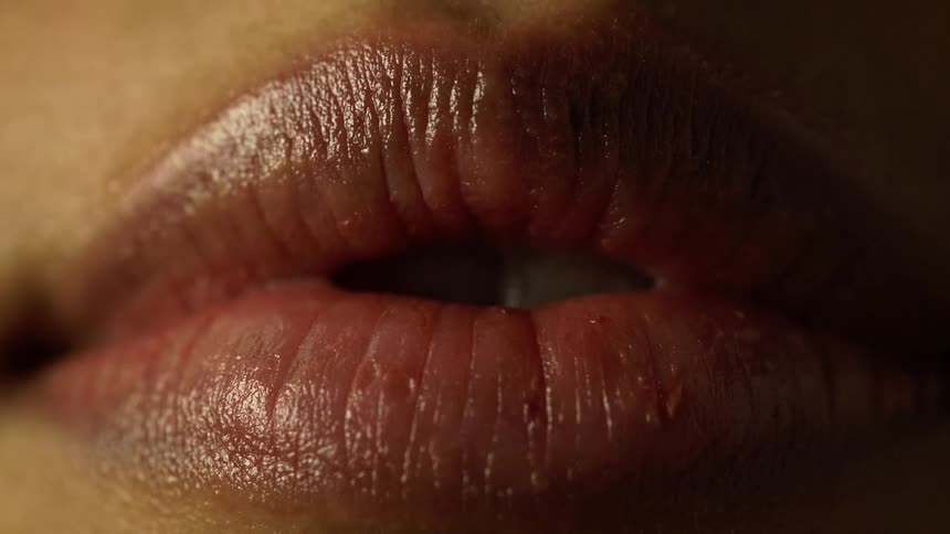 A mouth and lips opening slowly