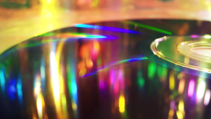 Closeup of a cd surface reflecting vibrant rainbowcolored light patterns