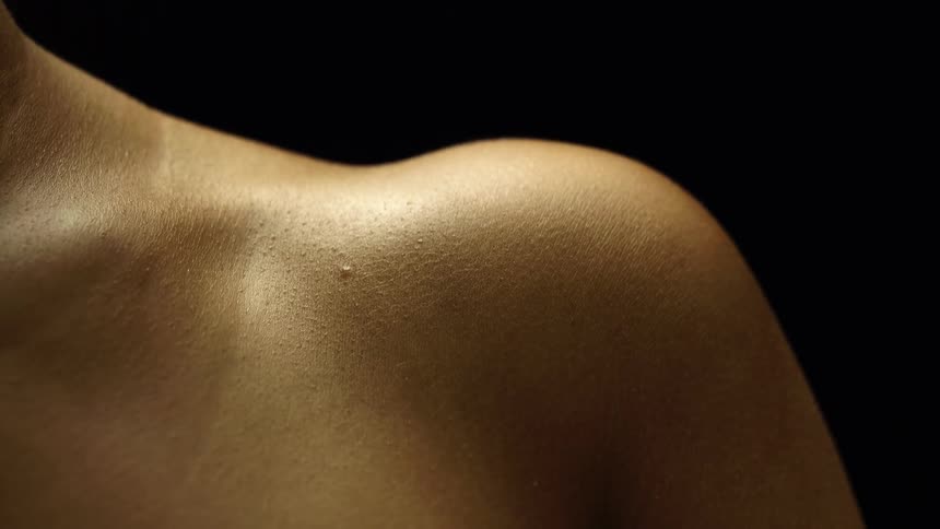 Closeup of a shirtless persons shoulder