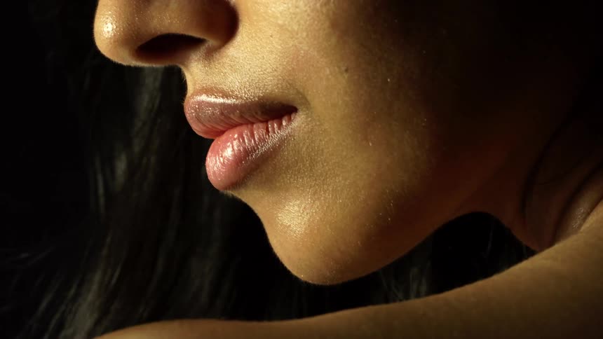 A woman is wearing lipstick