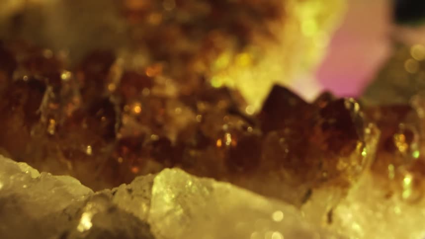 A collection geode rocks with glistening gold colored crystals