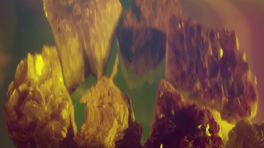 Digital effects warp the appearance of a cluster of crystaline minerals