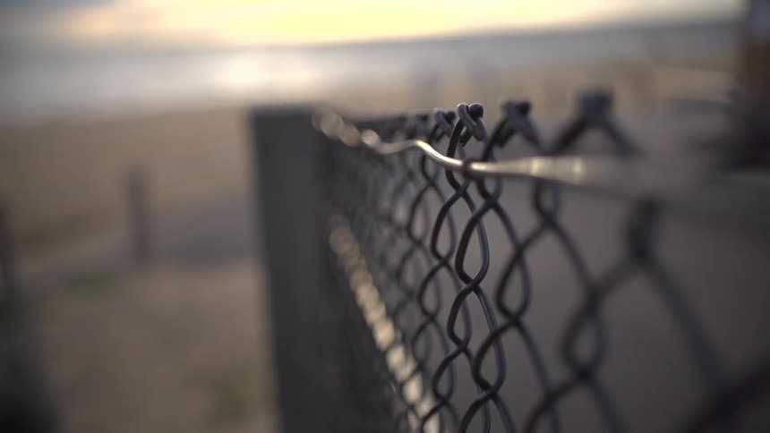 Close up on a fence near a beach