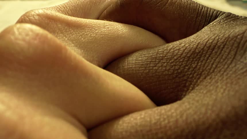 Two people are holding hands