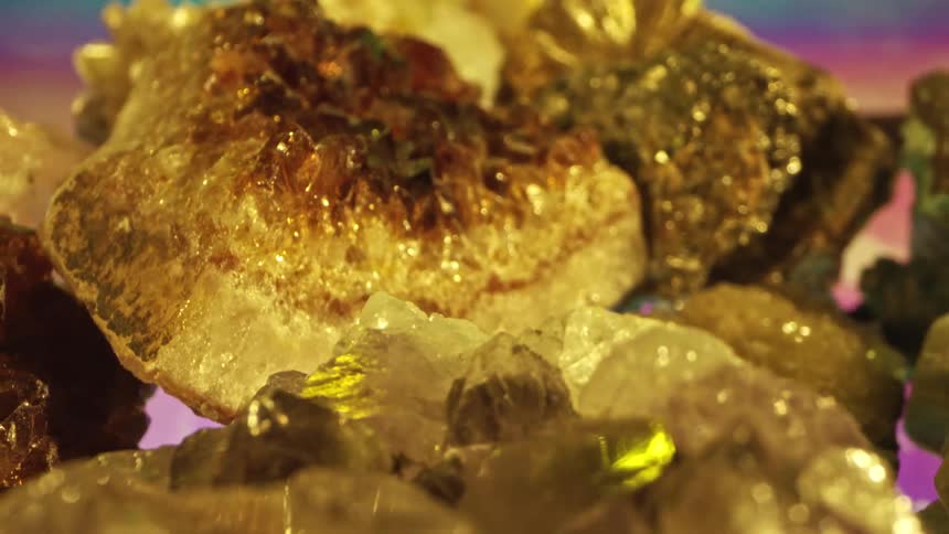 Yellow and gold geode rock crystals glistening and reflecting light
