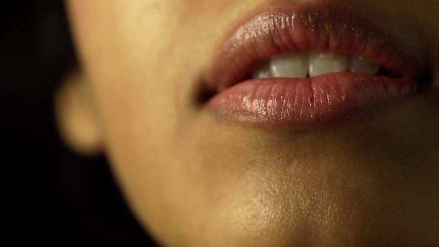 Close up of a womans mouth as she smiles
