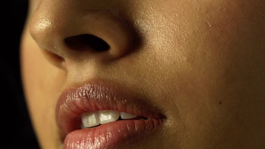 Closeup of a persons lips and nose with detailed skin texture