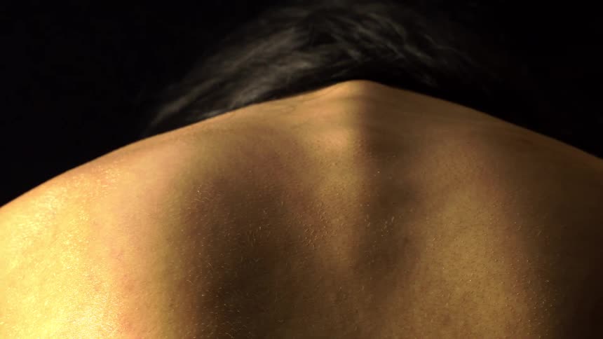 Closeup of a shirtless persons back